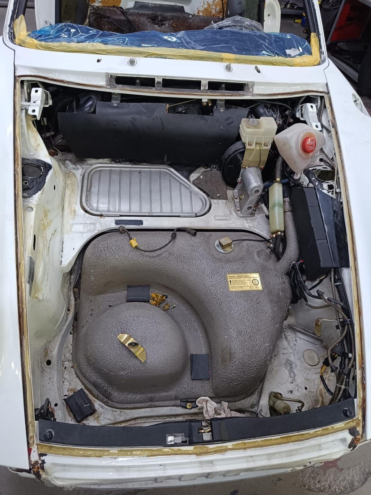 Front boot of the G-series 911 with the tank and brake circuit exposed