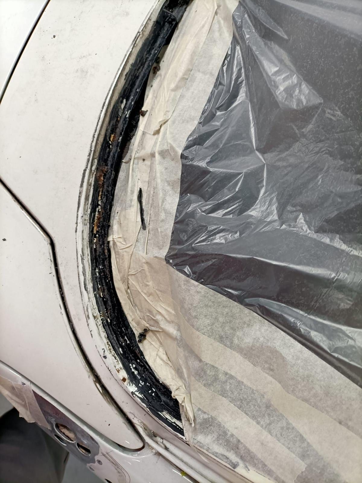 Rear screen aperture masked off with the sealant exposed