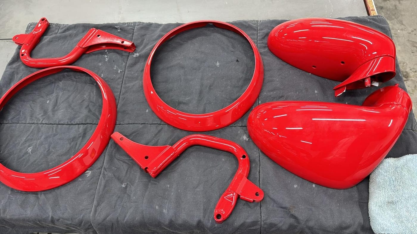 Freshly painted red 964 parts: headlight rings, mirrors and brackets