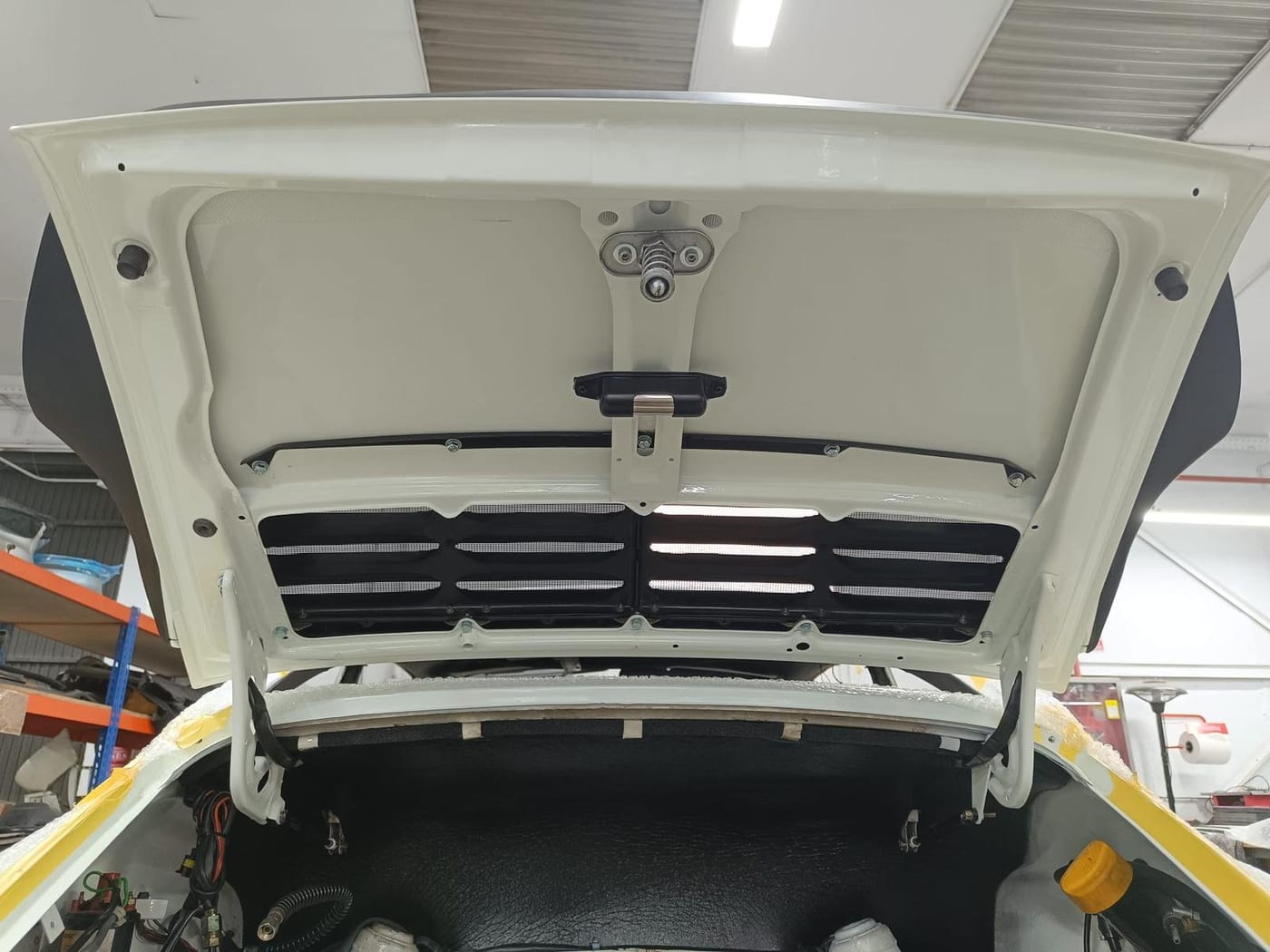 The engine lid with the grille refitted after painting