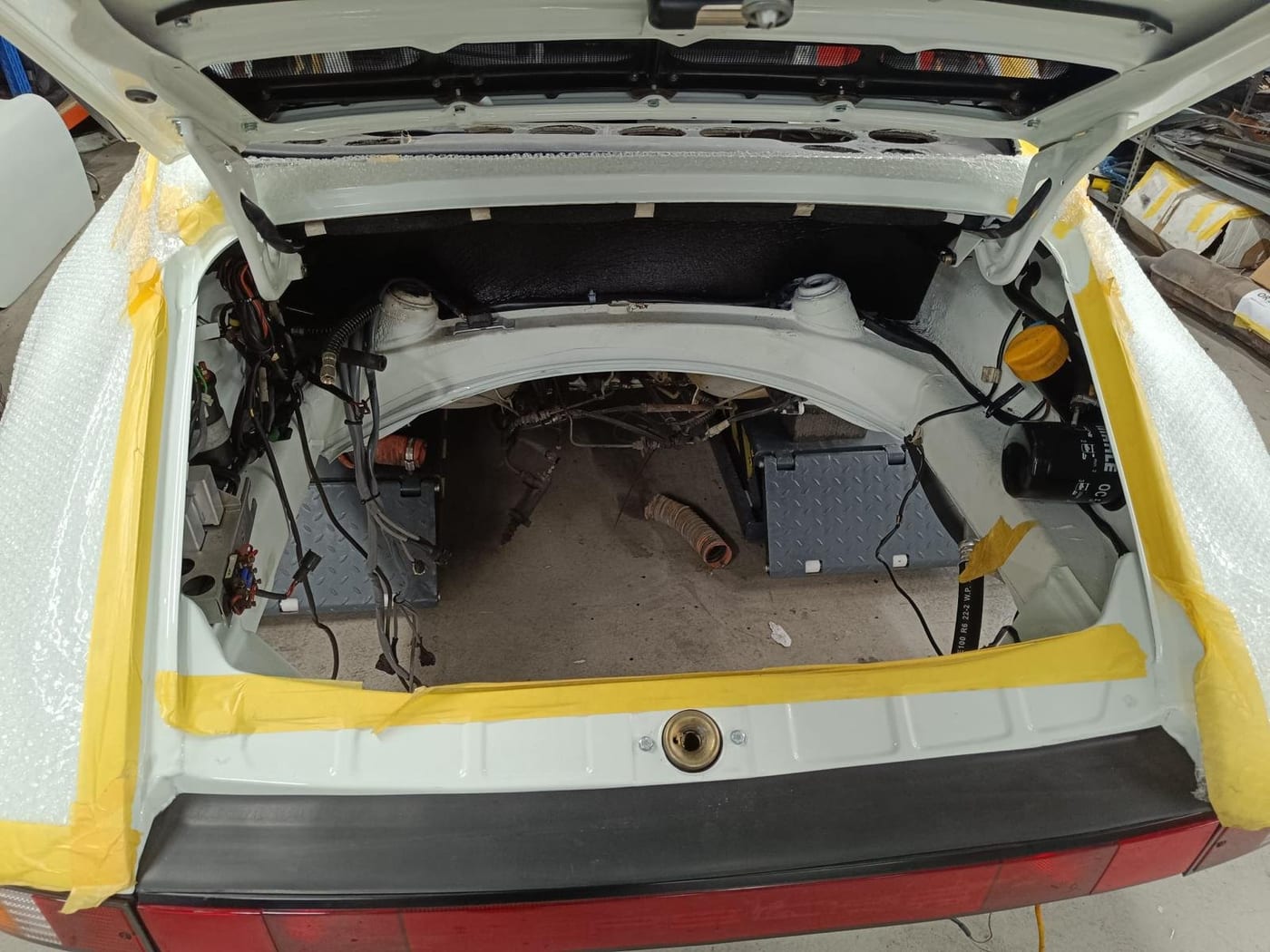 Engine bay of the G-series 911 masked after painting, bodywork protected